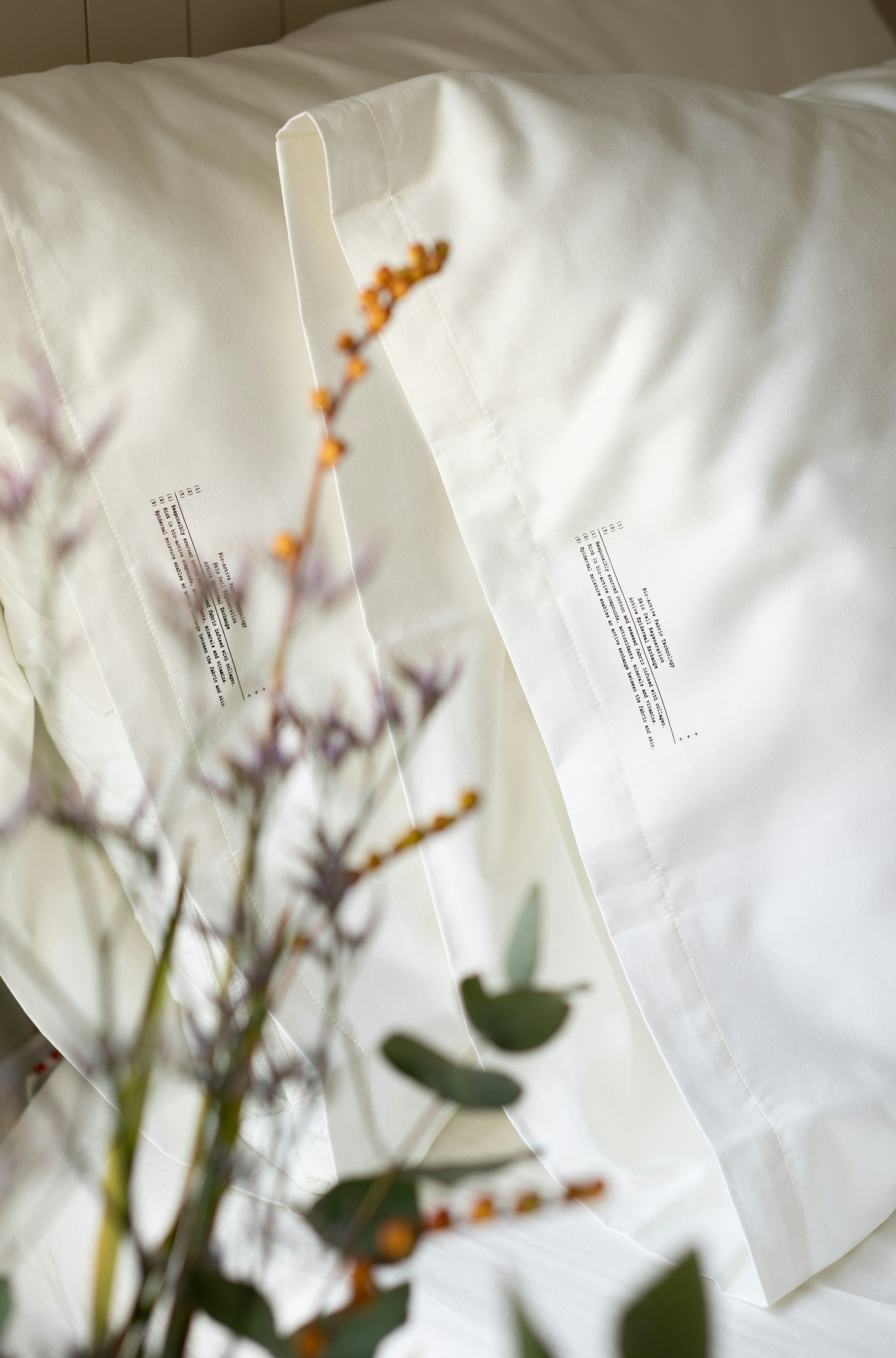 a bouquet of flowers sitting on top of a bed