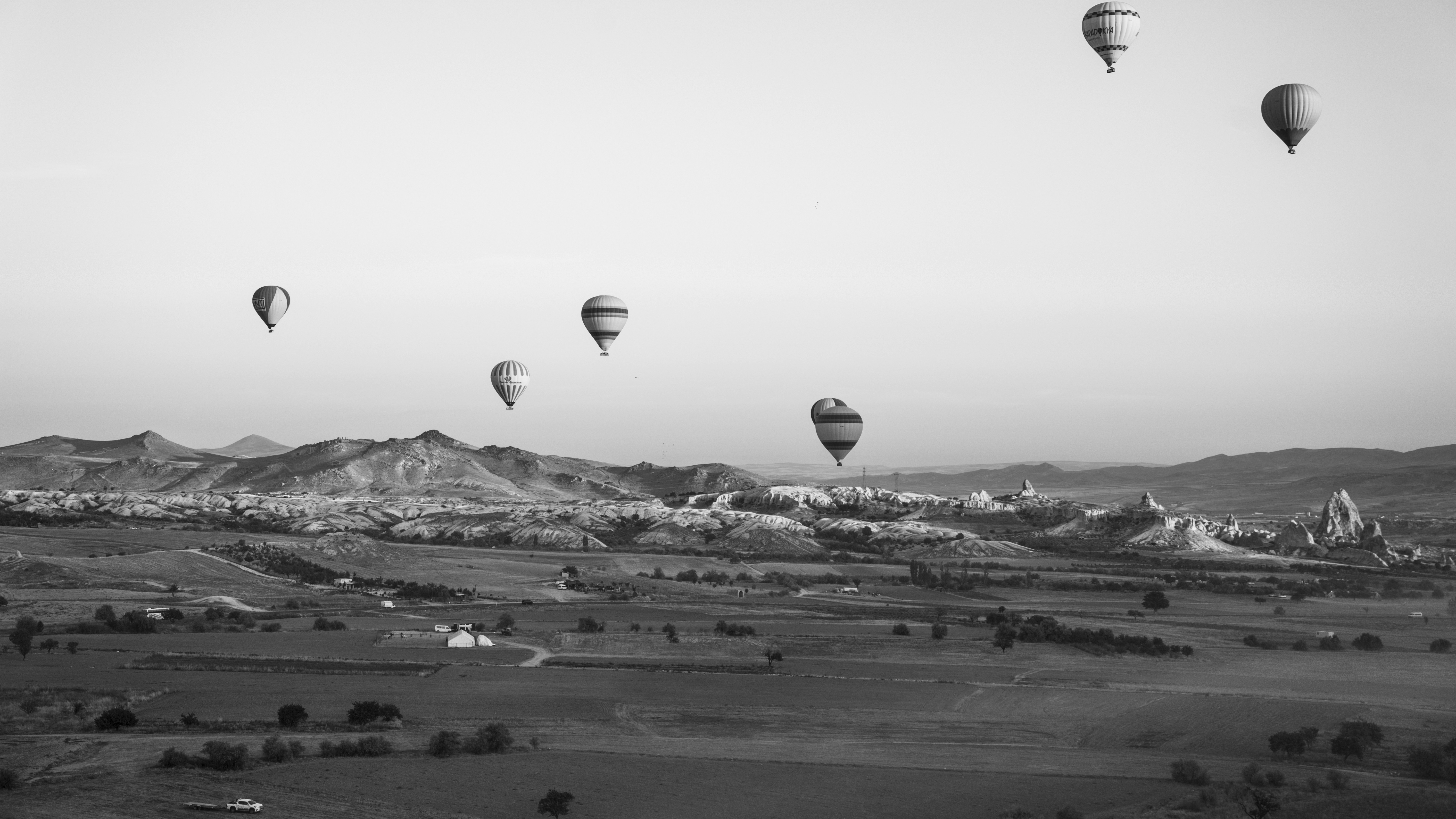 a group of hot air balloons flying in the sky