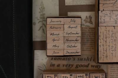 Historic calendar pages with handwritten notes and a QR code.