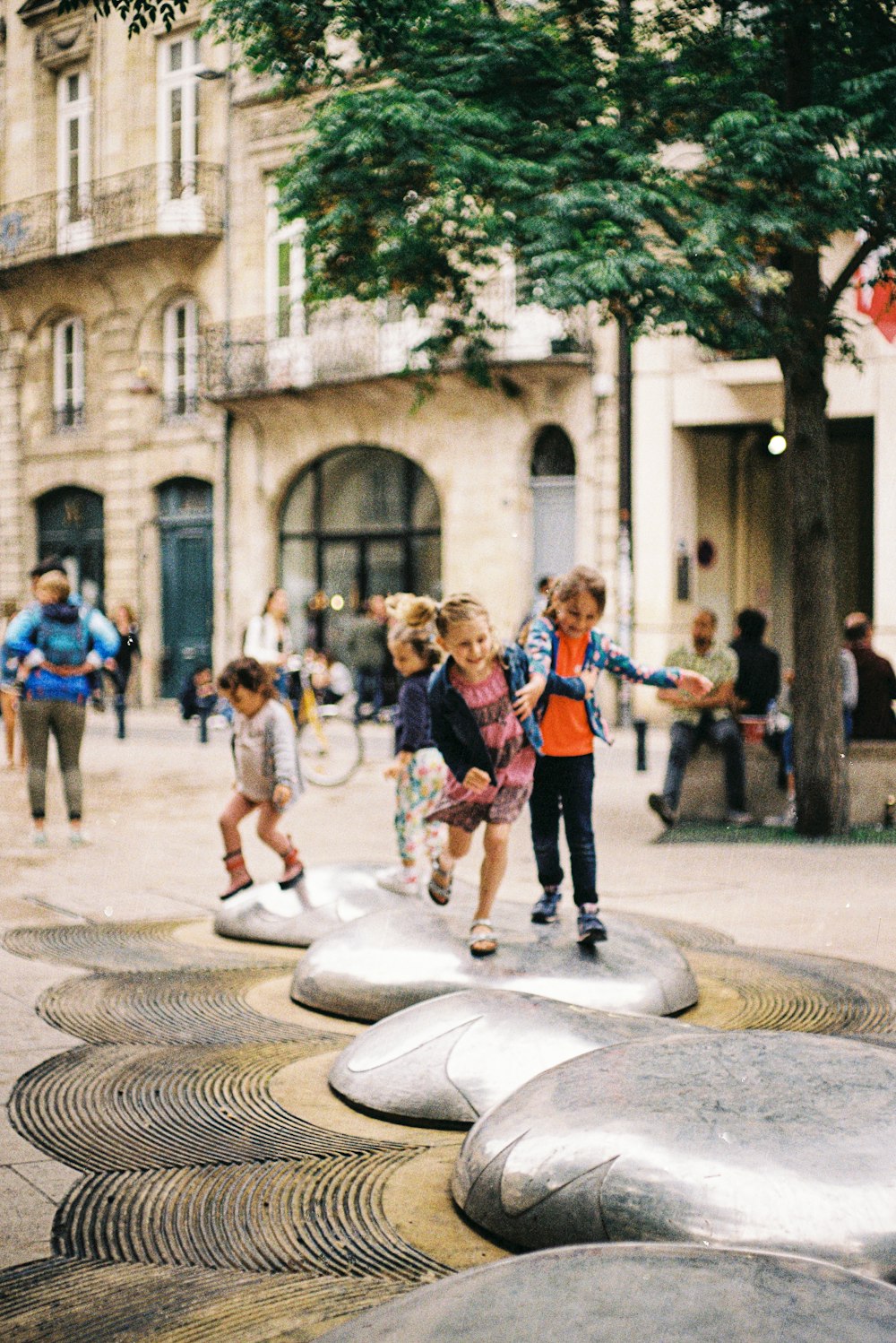 a group of children playing in a park