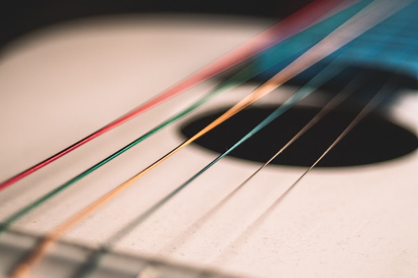 Abstract close-up of guitar strings vibrating, capturing the raw energy of sound in motion.
