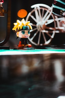 a close up of a figurine on a table