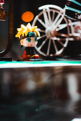 a close up of a figurine on a table
