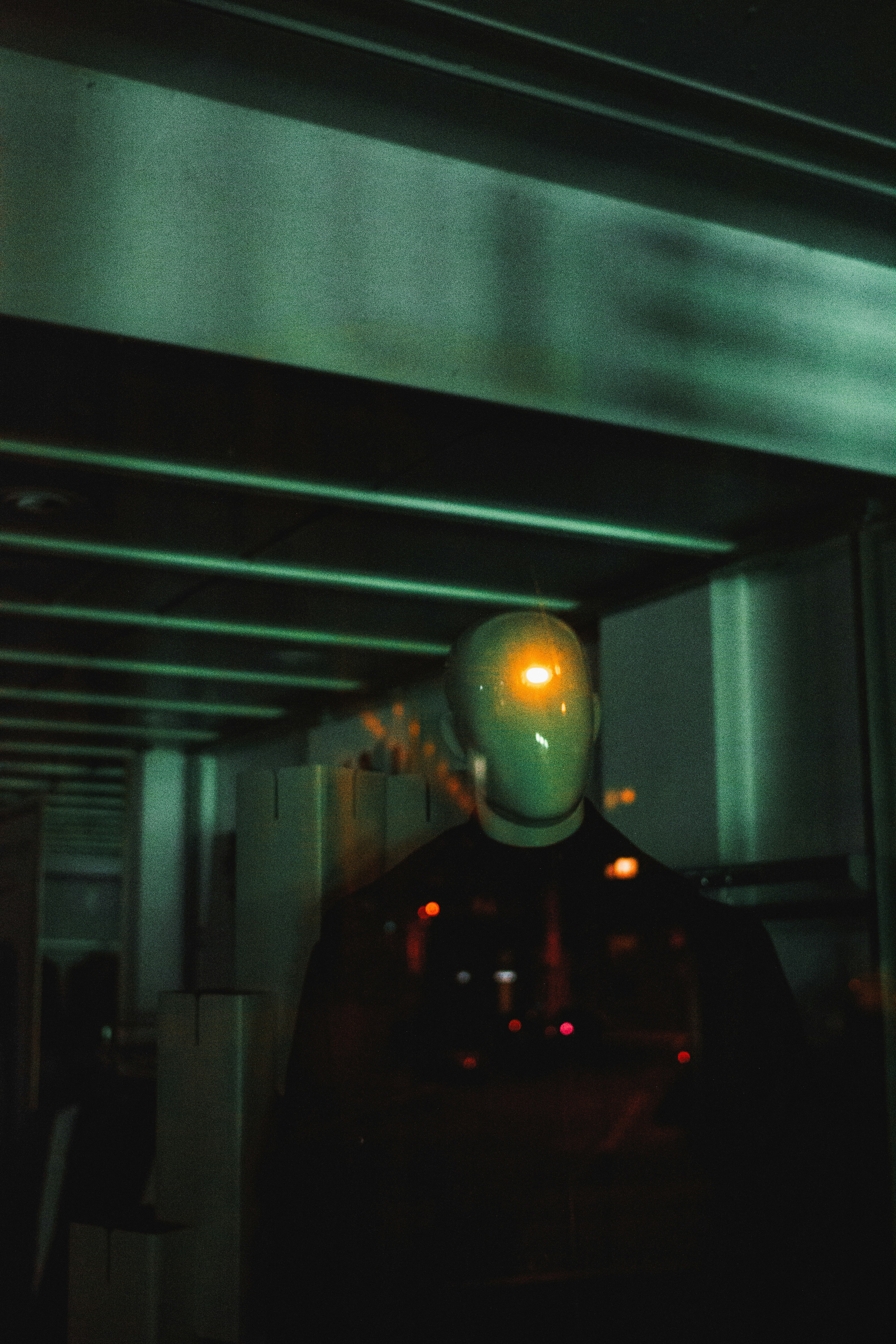 A man in a dark room with a yellow light on his face photo – Free Grey ...