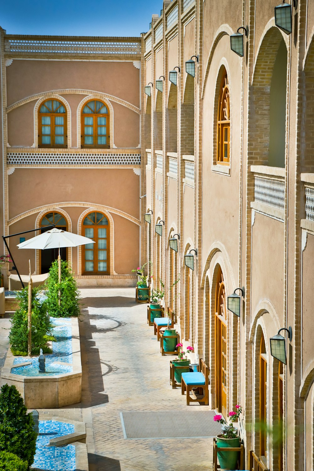 a large building with a courtyard and a fountain