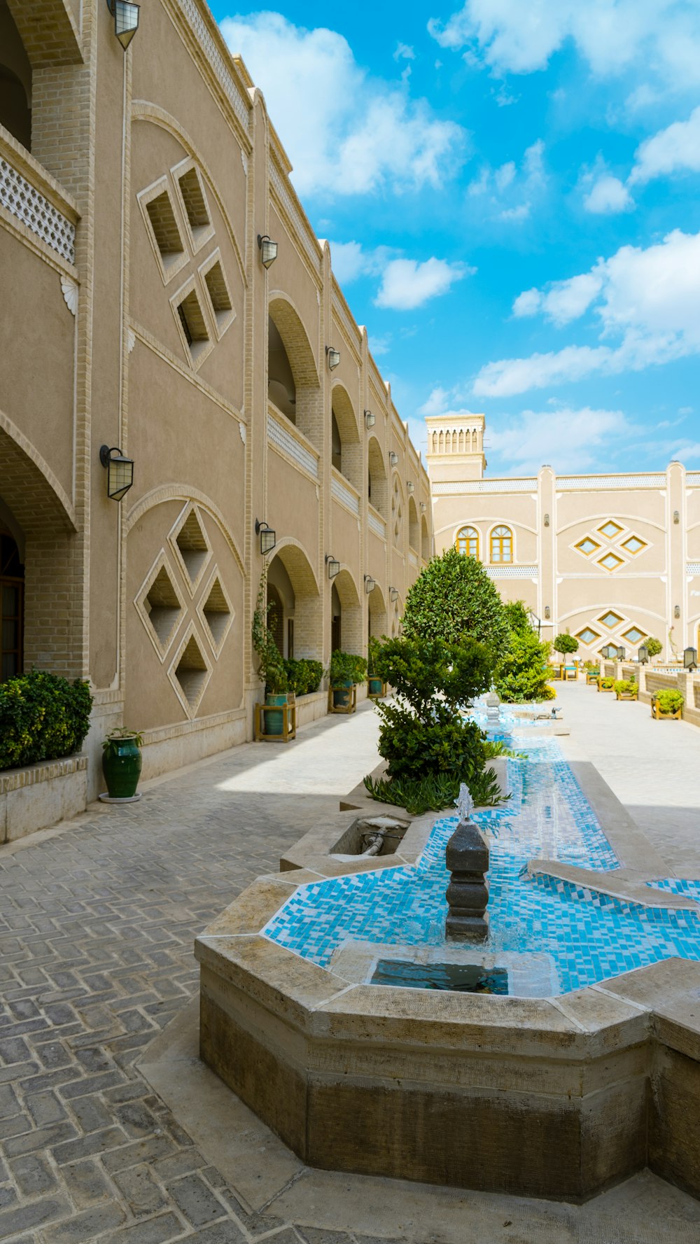 a building with a fountain in front of it