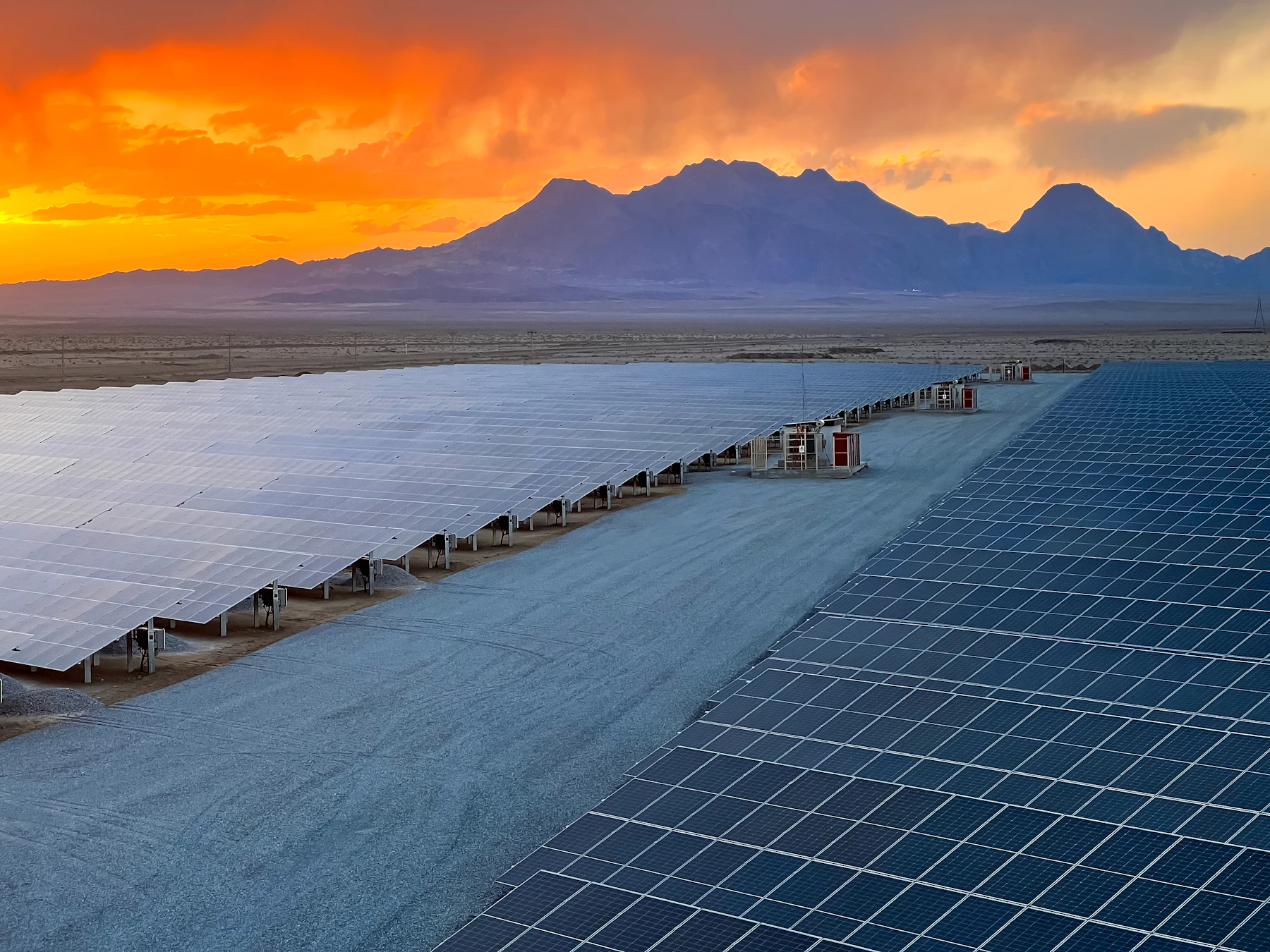Ground-mounted solar plant with power electronics enclosure