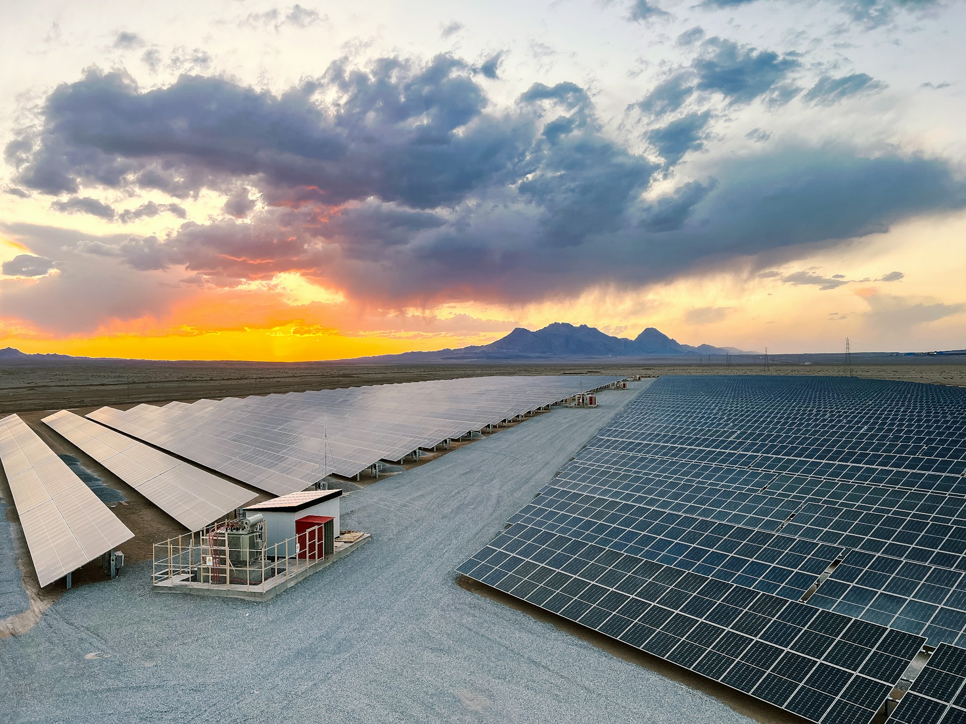 a large array of solar panels in a desert