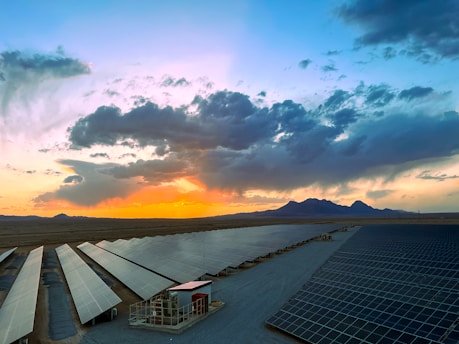 a large array of solar panels in a desert