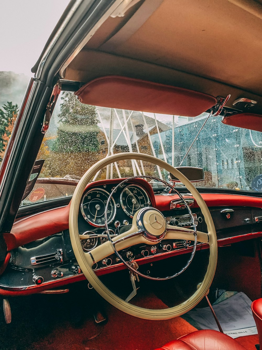 the interior of a car with a steering wheel and dashboard