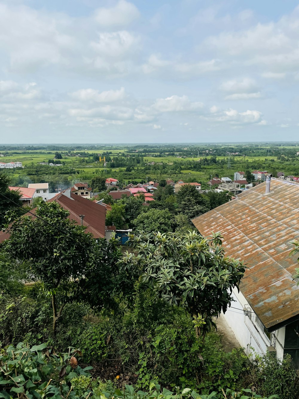 a view of a small village from a hill