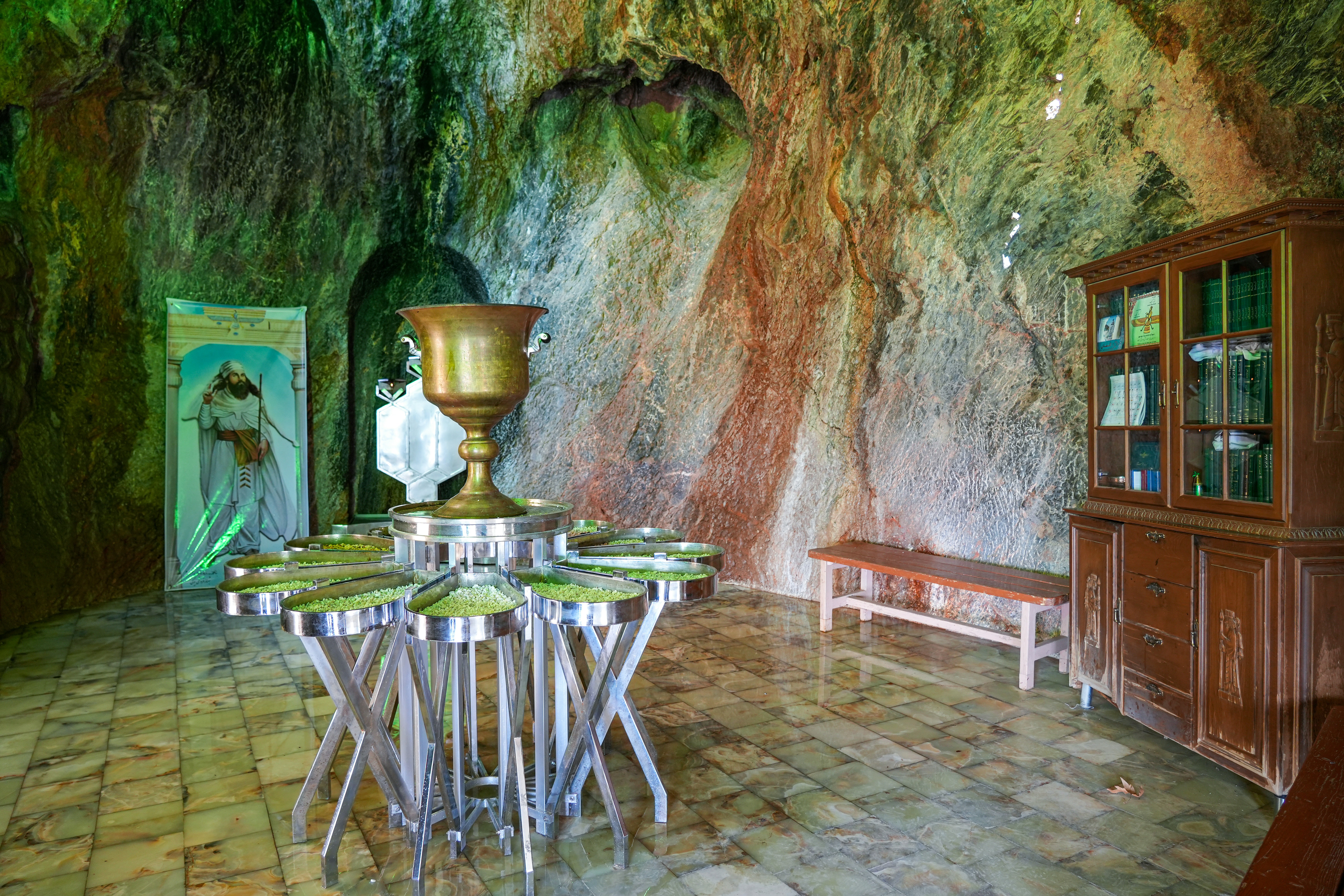 a room that has a table and a vase on it