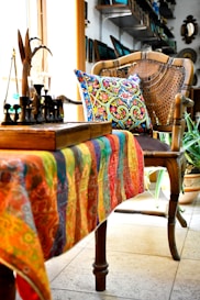 a chair with a colorful blanket on top of it