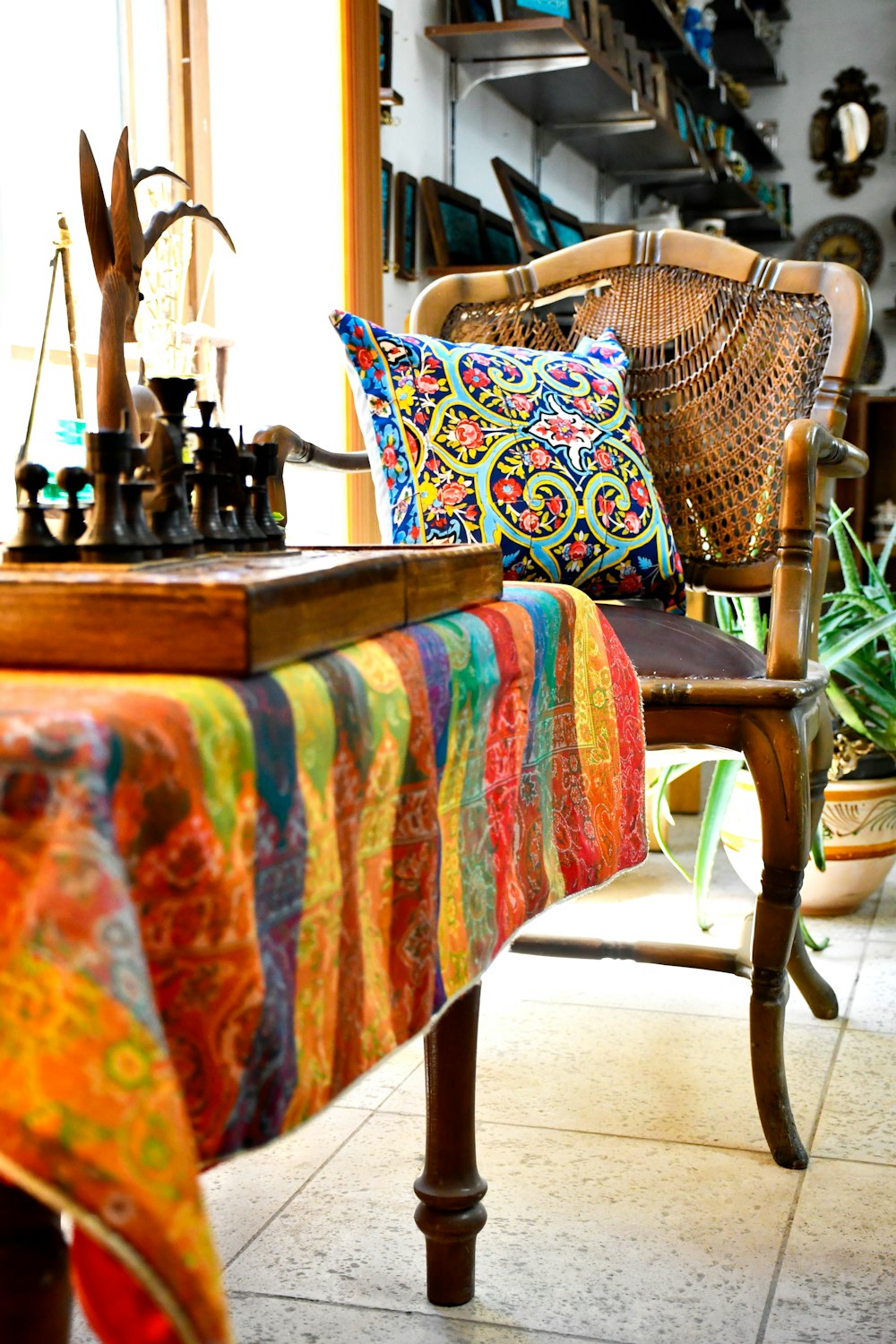 a chair with a colorful blanket on top of it