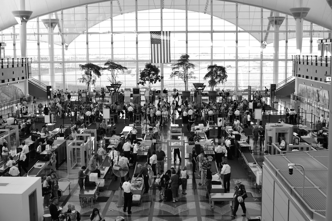 a black and white photo of people in an airport, Denver DIA Security Check Point