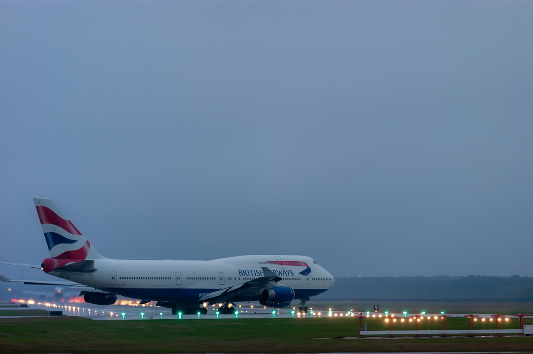 a large jetliner sitting on top of an airport runway, British Airways Boeing 747 on Takeoff Hold at Houston IAH
