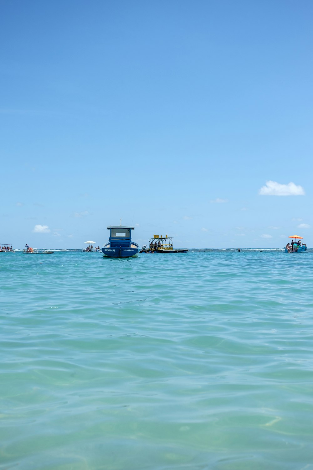 a boat floating on top of a large body of water