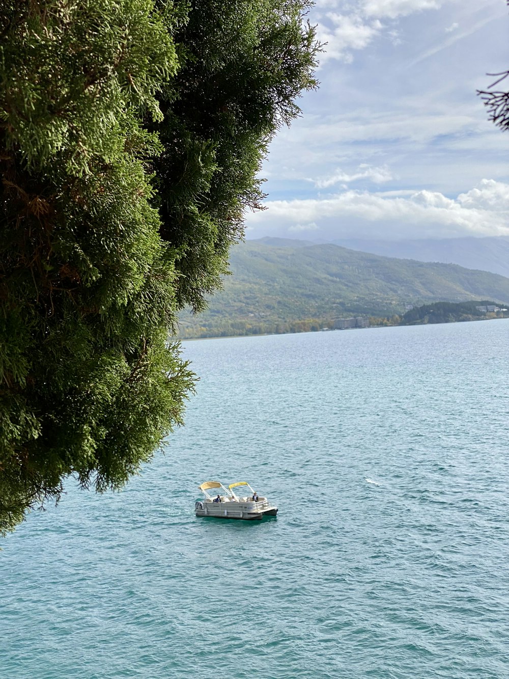 a small boat floating on top of a large body of water