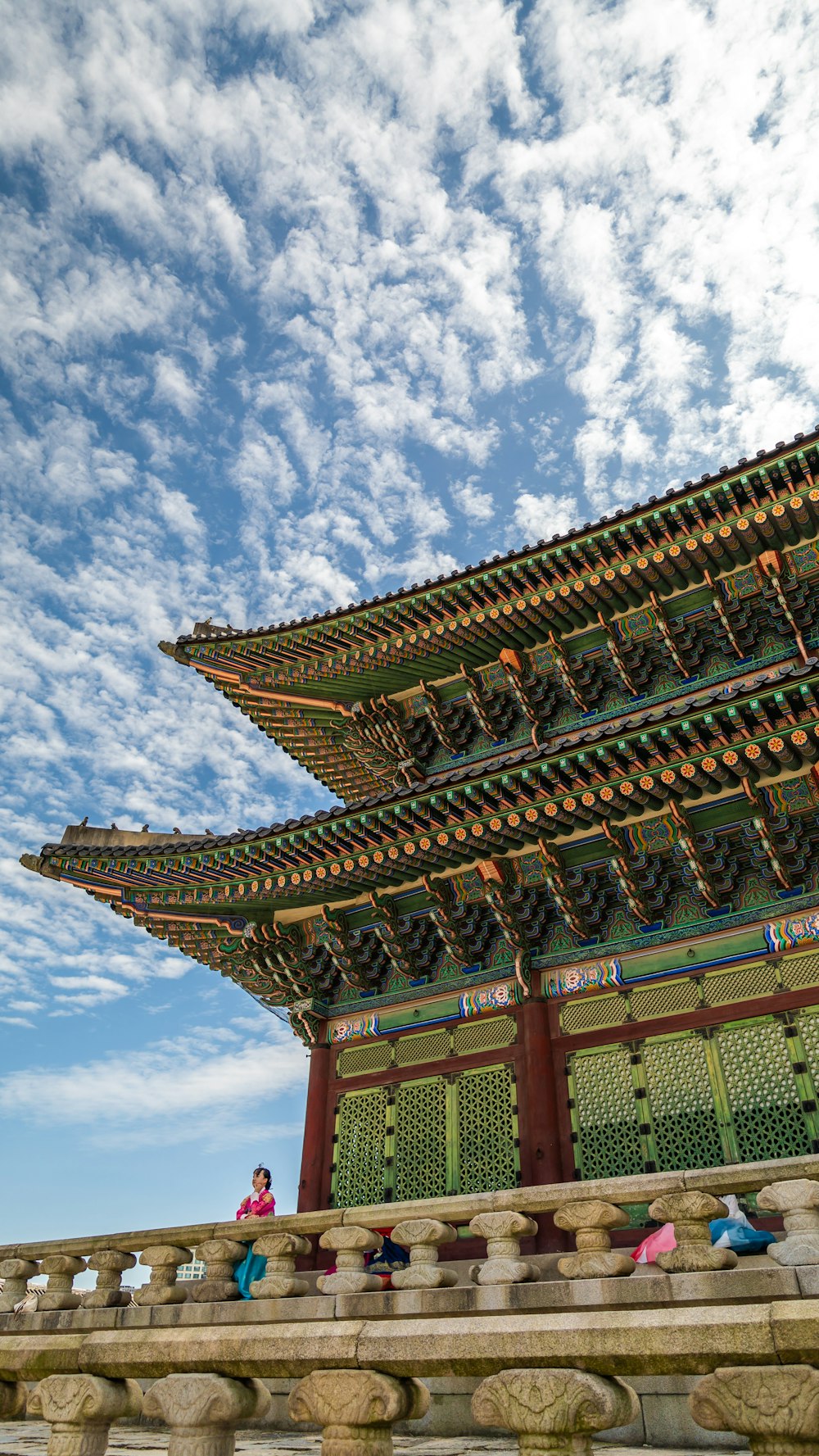 a tall building with a sky in the background