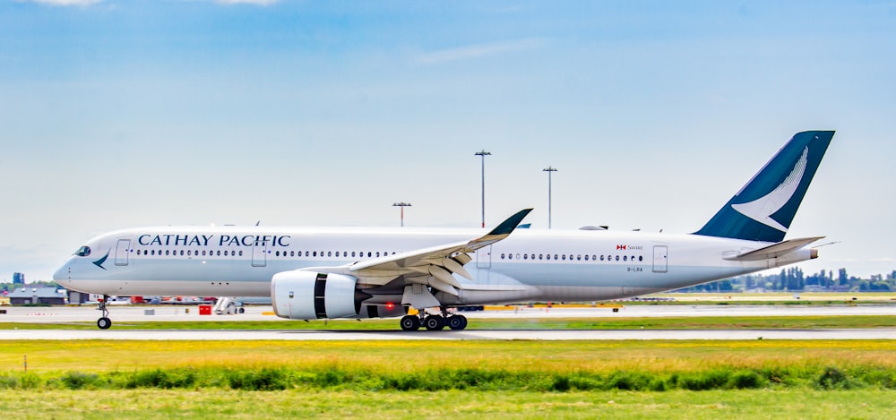 a cathay pacific airplane on the runway