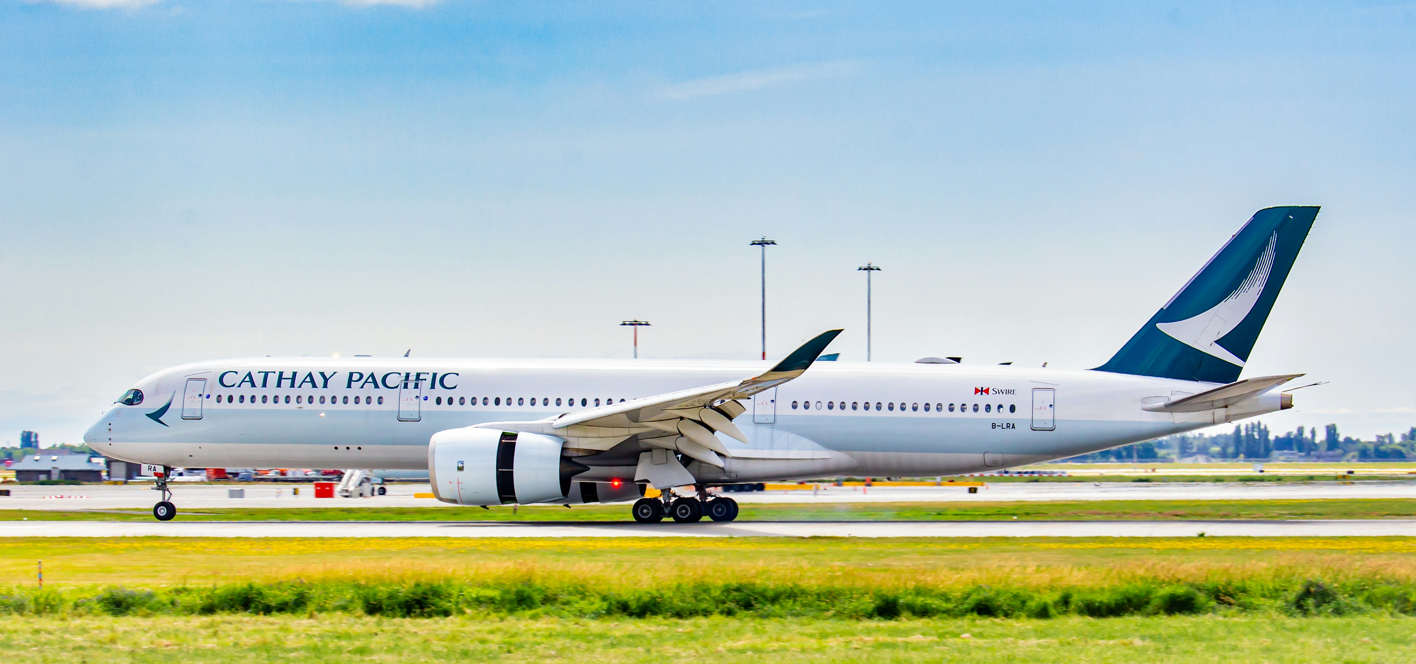 a cathay pacific airplane on the runway