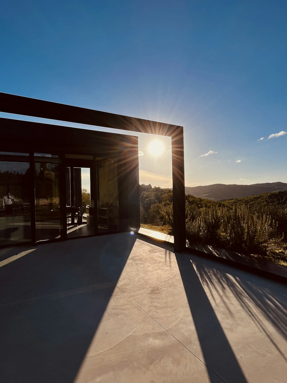 the sun is shining through the windows of a house