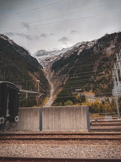 Workers maintaining the railway lines with mountains in the background