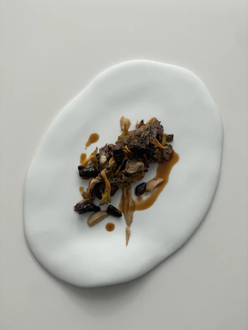 Artisanal dishes beautifully plated in a minimalist style, capturing the essence of handcrafted food.