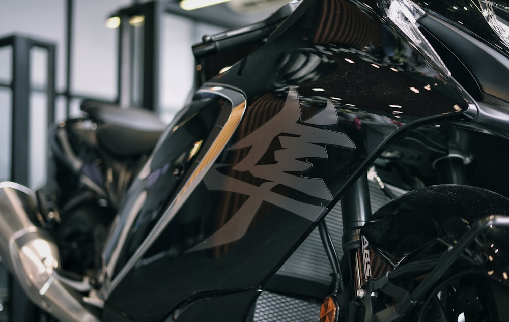 a close up of a motorcycle parked in a garage