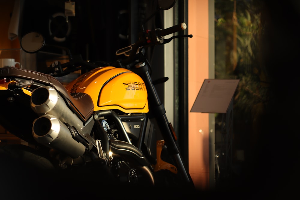 a close up of a motorcycle parked near a building