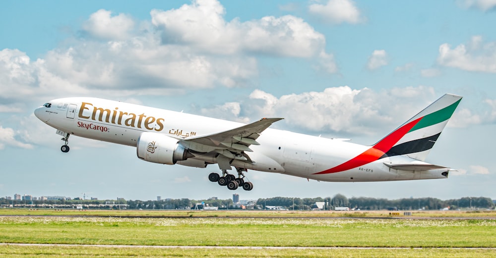 a large jetliner taking off from an airport runway