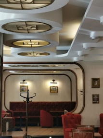 a room with a lot of chairs and a chandelier