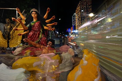 A lively scene from the Sacred Goddess Soiree with attendees enjoying art and connection.