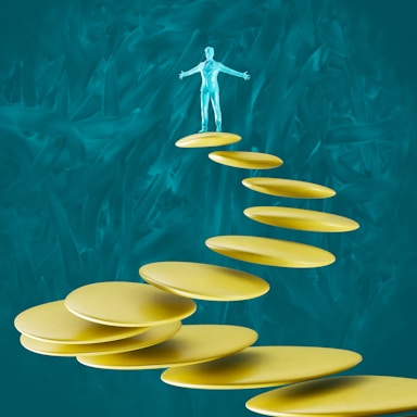 a man standing on top of a set of yellow plates