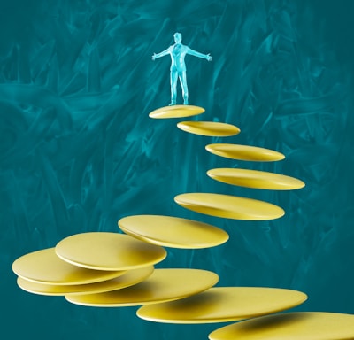 a man standing on top of a set of yellow plates