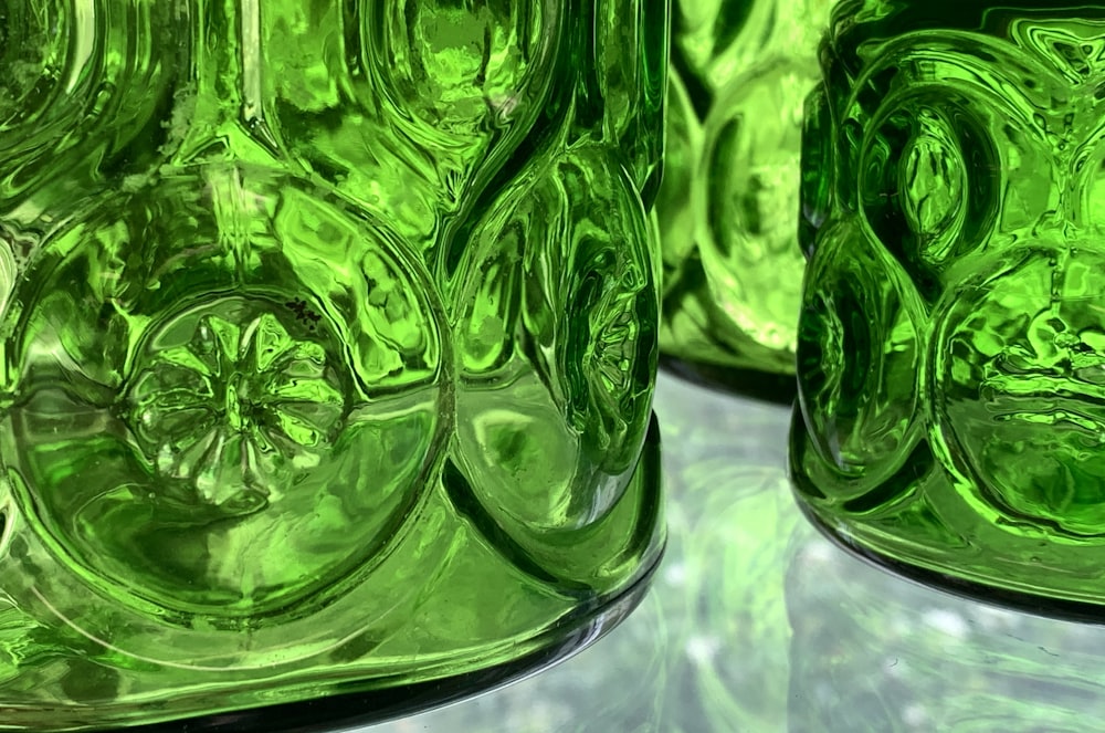 a close up of a green glass vase