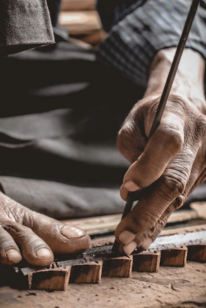 a person is working on a piece of wood