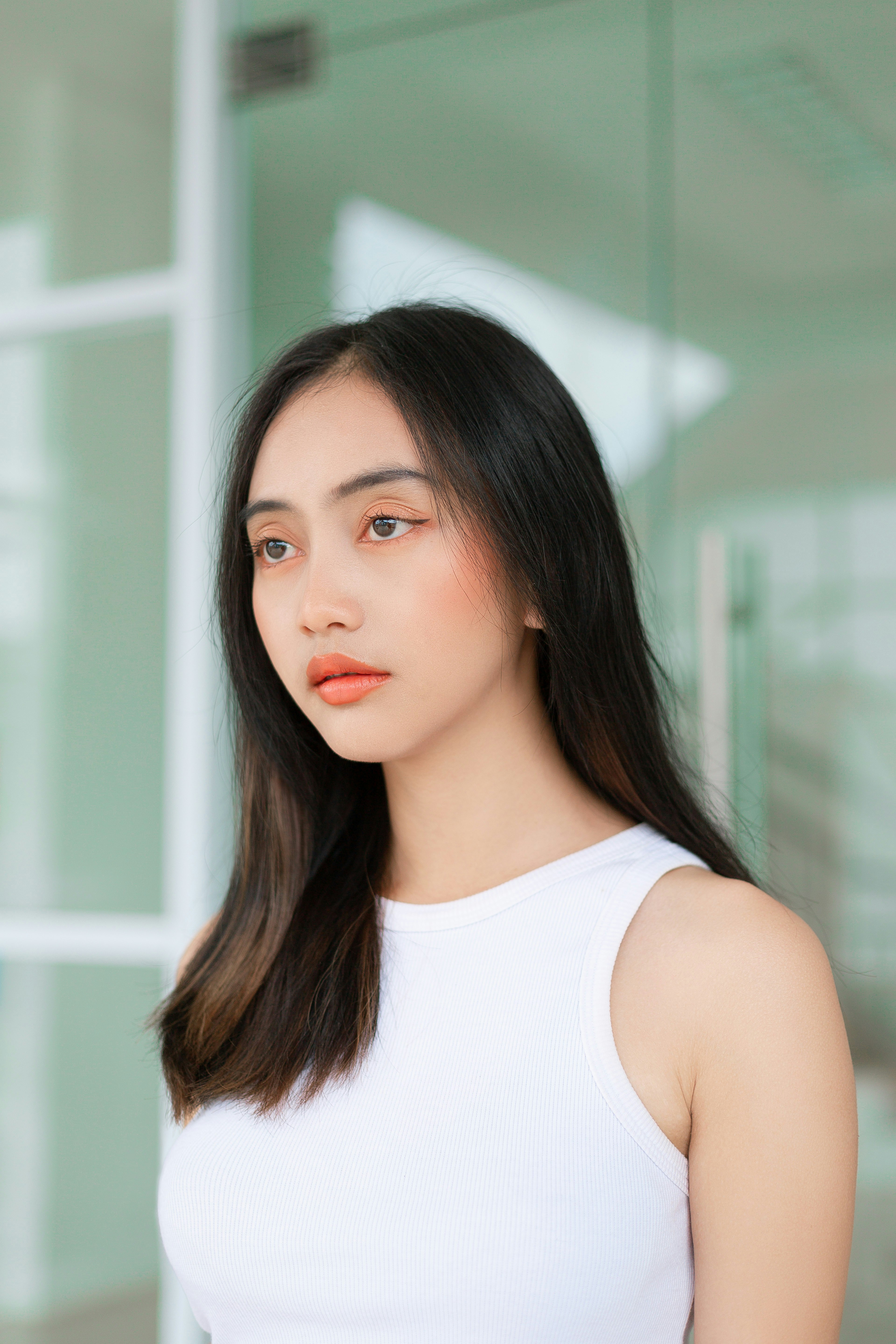 A woman with long black hair wearing a white top photo – Free Head ...
