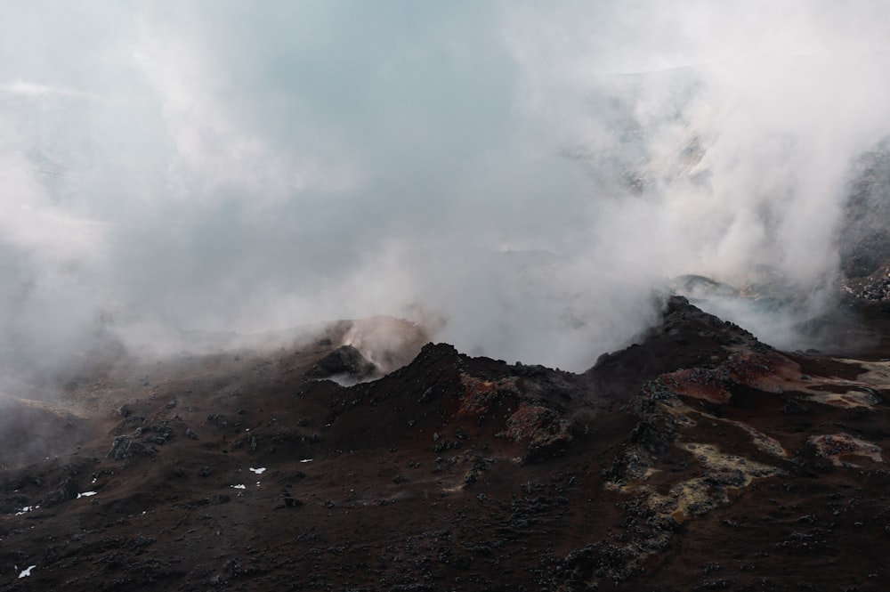 a view of a mountain with steam coming out of it