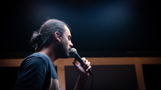 a man with a microphone in his hand