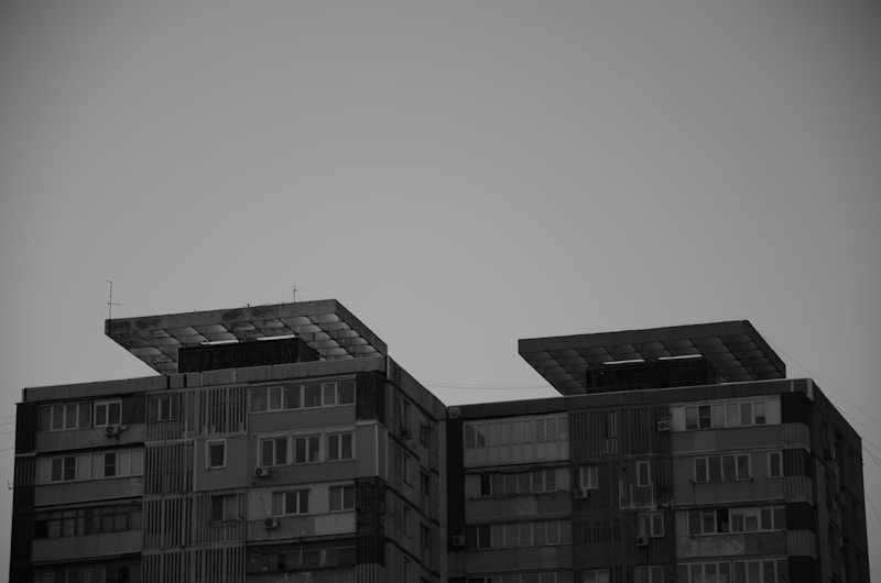 two buildings with solar panels on top of them