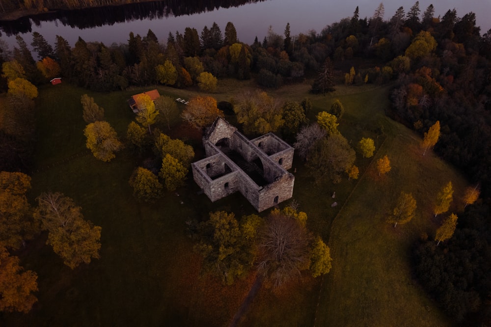 an aerial view of a castle surrounded by trees