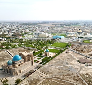an aerial view of a large building with a blue dome