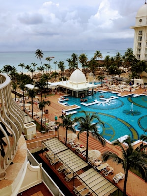 a view of a resort pool from a balcony
