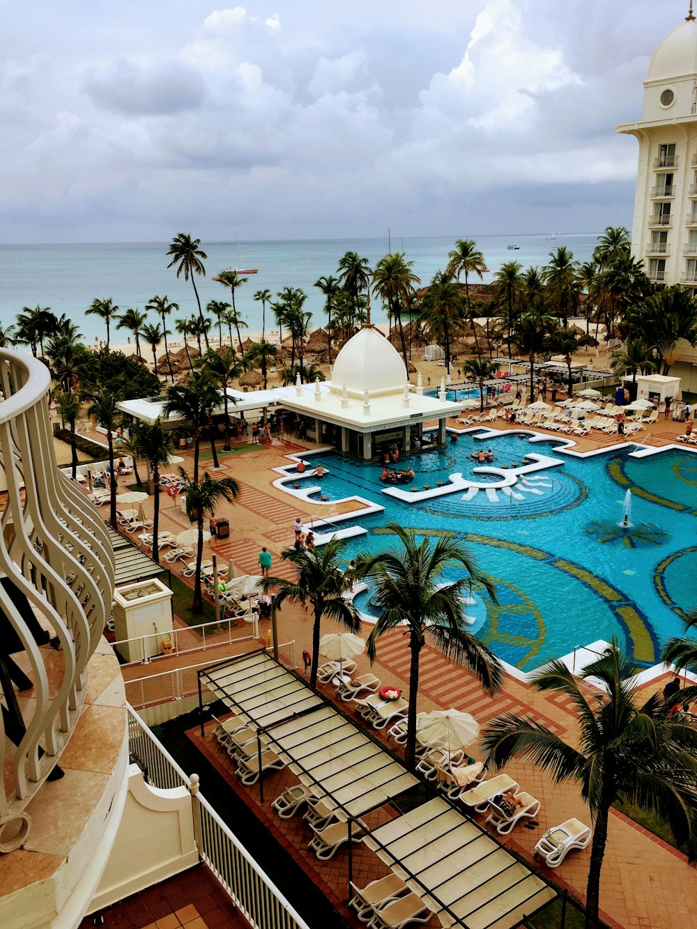 a view of a resort pool from a balcony