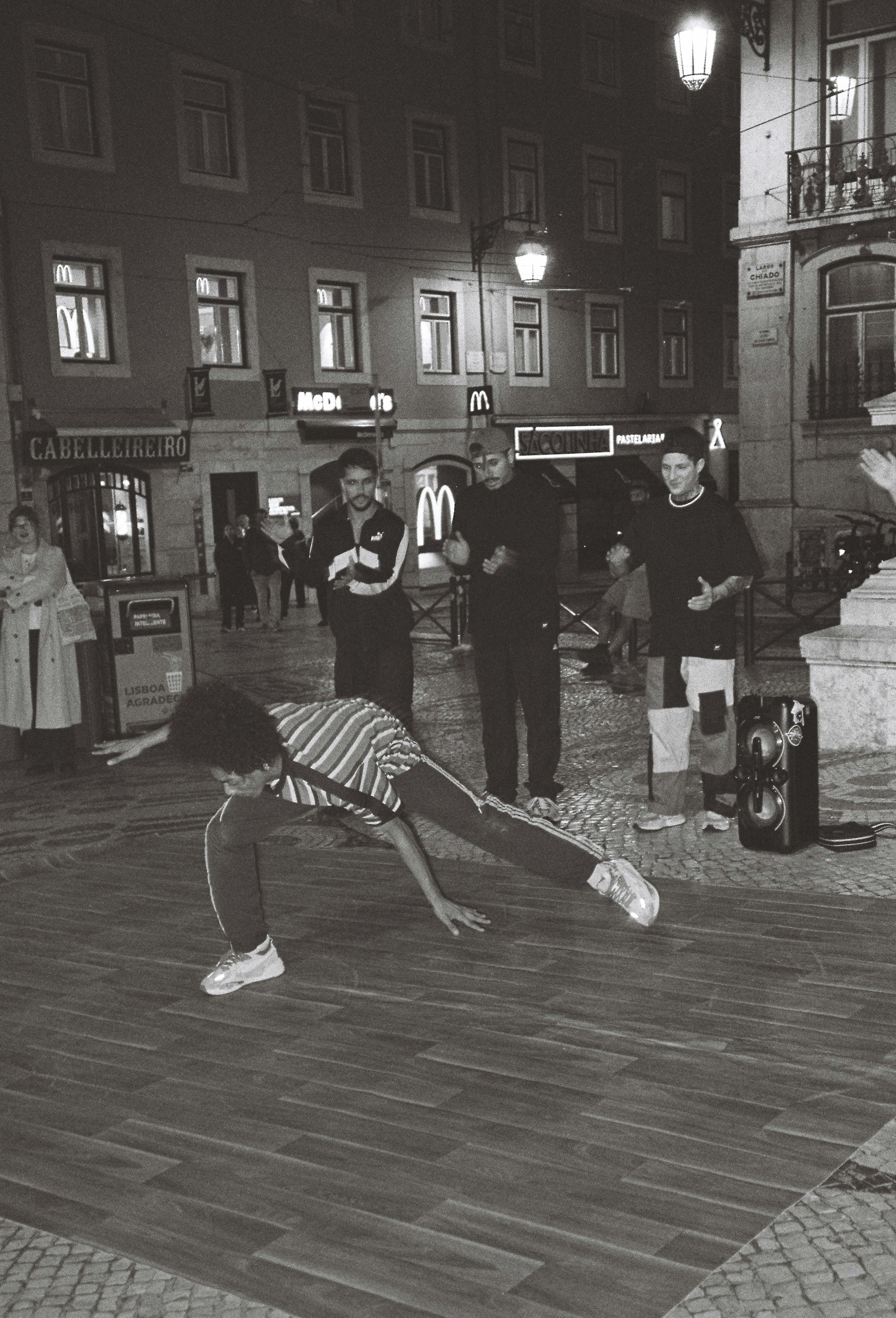 a woman is bending over on the ground