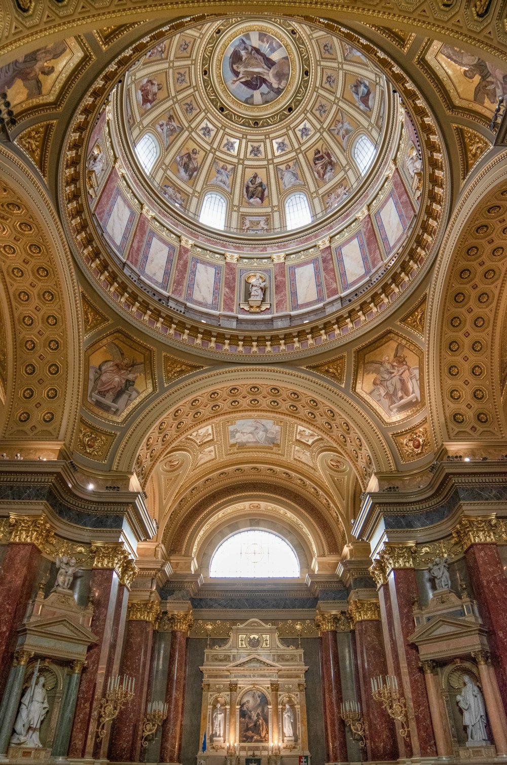 the ceiling of a large church with a dome
