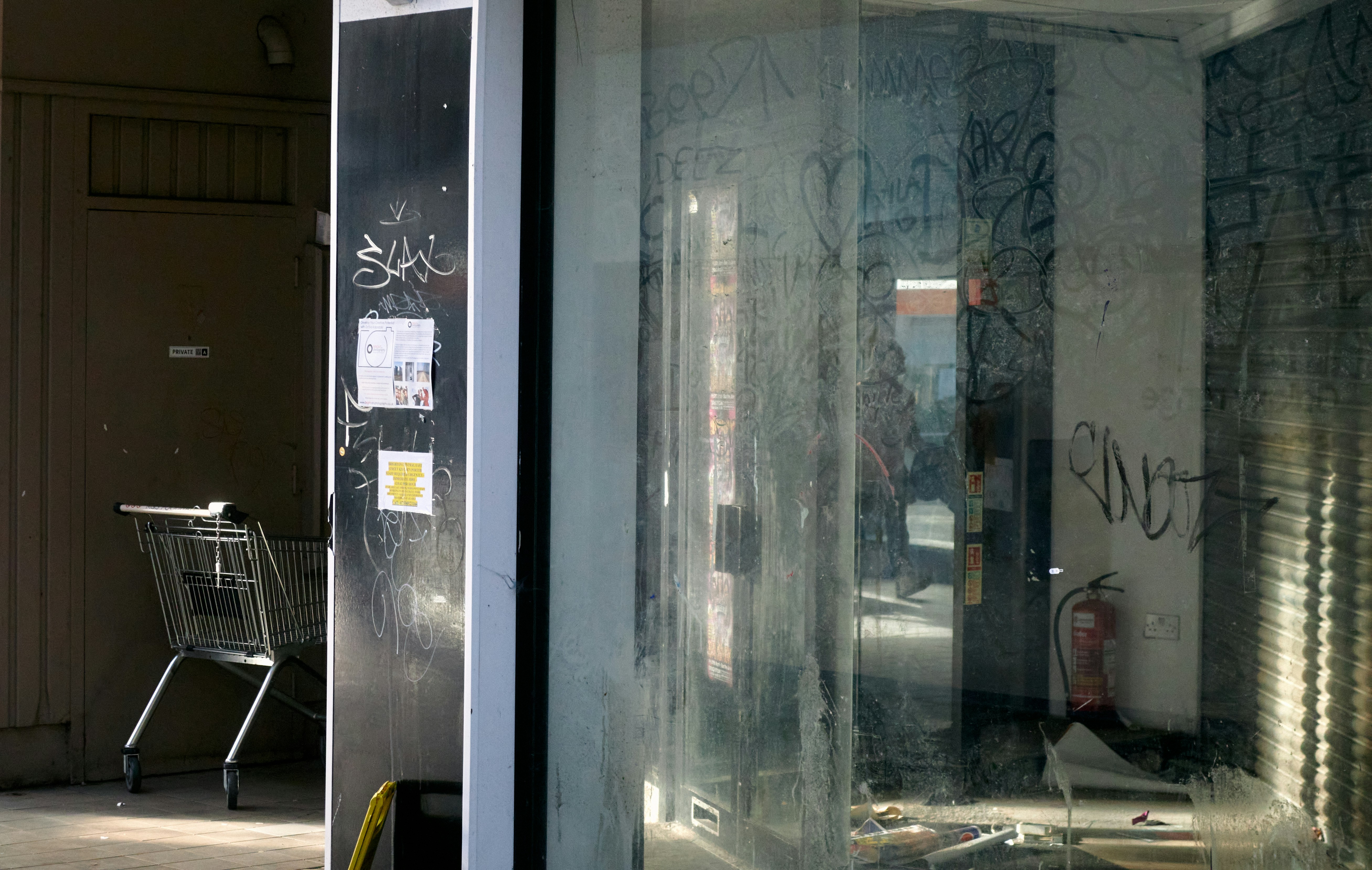 Modern auto repair shop with an electric car raised on a hydraulic lift