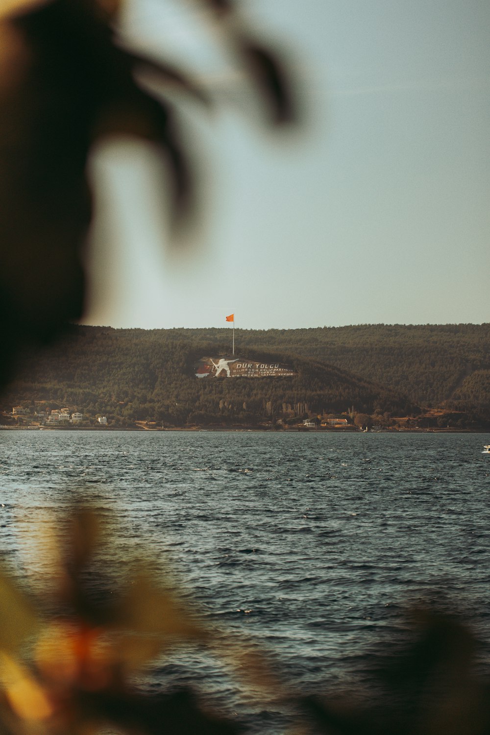 a body of water with a boat in the distance