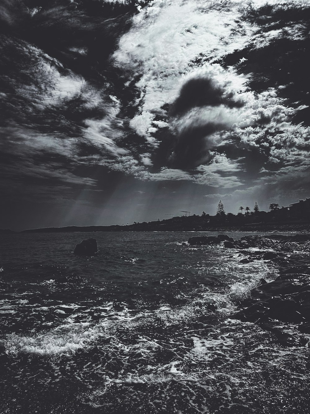 a black and white photo of the ocean